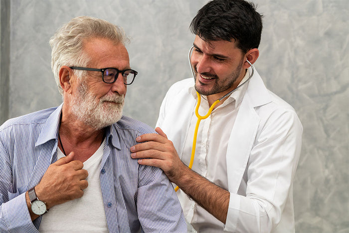 Man having his heart health checked during a medical visit, emphasizing the importance of heart-supportive nutrients and anthocyanins.