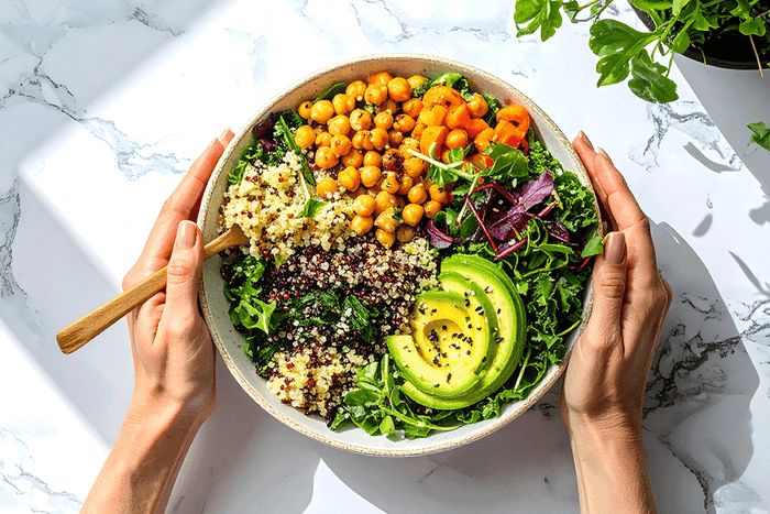 A fiber-rich bowl packed with quinoa, chickpeas, leafy greens, and avocado to support digestion, blood sugar balance, and overall gut health.