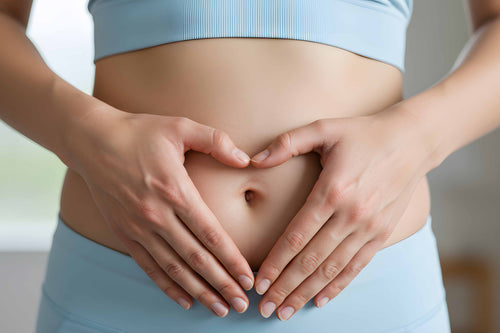 Hands forming a heart over the abdomen, symbolizing care for gut health and supporting a balanced microbiome reset.