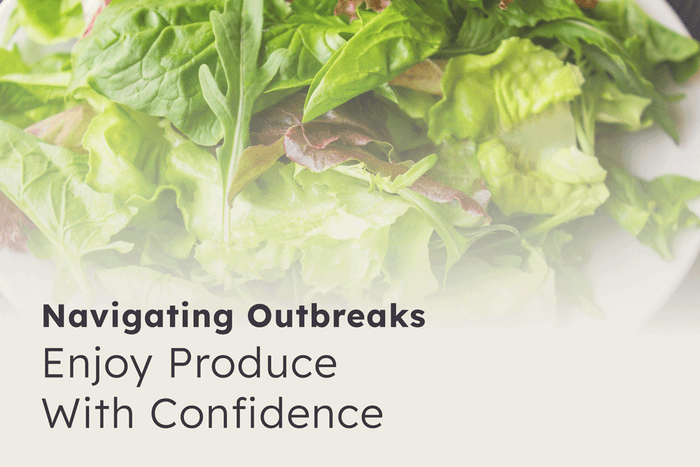 Fresh leafy greens with the message “Enjoy Produce With Confidence,” highlighting practical food safety guidance for navigating outbreaks.