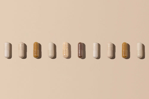 A row of assorted capsules represents the many choices consumers face when navigating the world of dietary supplements.