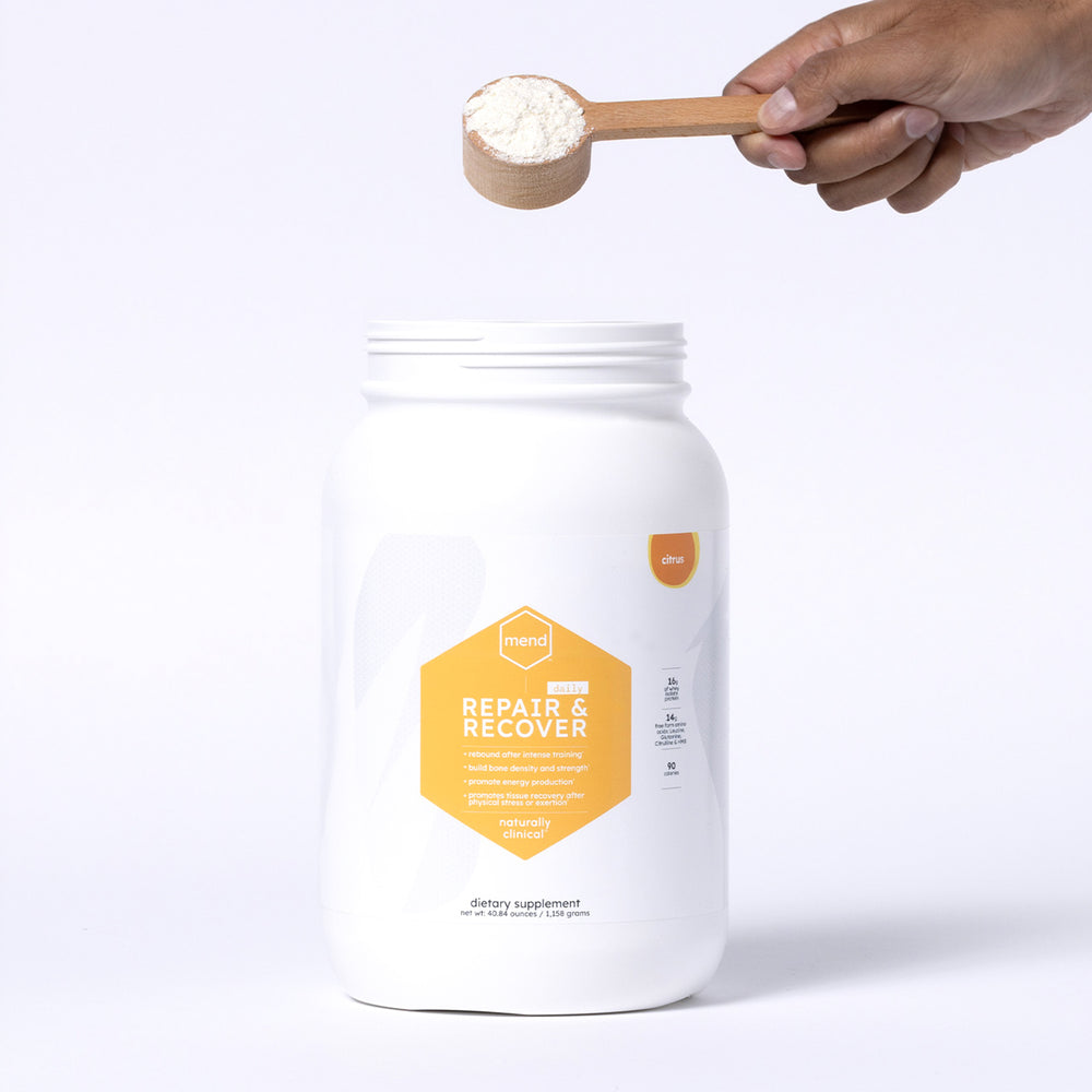 Mend Repair + Recover: Daily product image; premium clinical-style whey protein recovery formula tub for tissue repair and holistic body rebuilding.